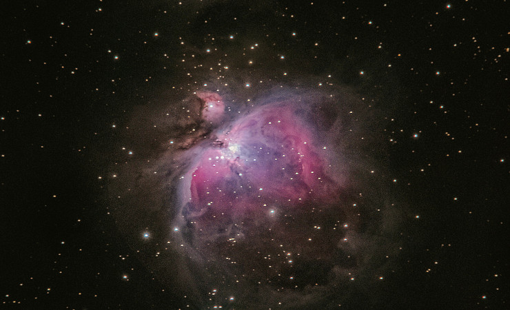 A pinkish purplish starry nebula.